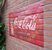 Coca Cola decal on brick wall